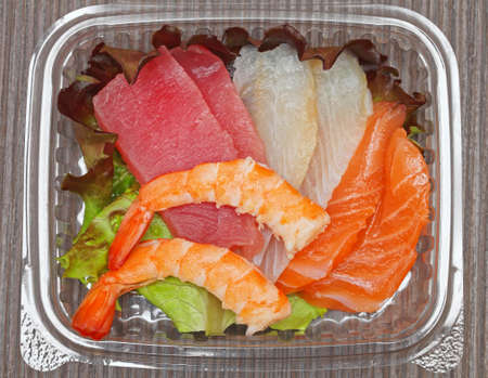 Fresh Raw Fish Slices Japanese Sashimi in Boxの写真素材