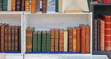 Rare Books in Wooden Bookcase at antique Marketの写真素材