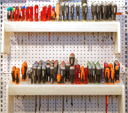 Various Screwdrivers Hand Tools at Shelf in Service Garage