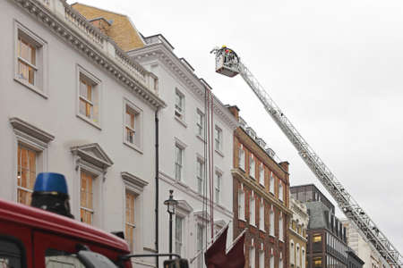 Fire Fighters at Telescopic Boom Aerial Ladder Platform