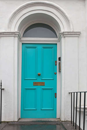 Turquoise Entrance Door With Arch at House in Londonの写真素材
