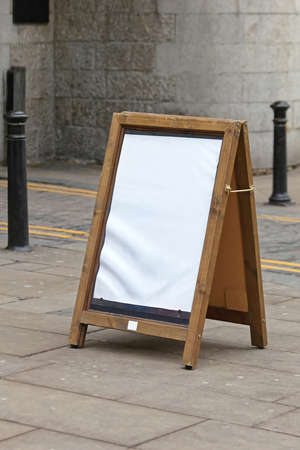 Empty Wooden Advertising A Board on Street Sidewalkの写真素材