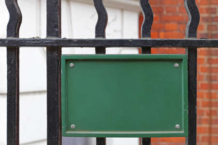 Empty Space Green Sign on Metal Fenceの写真素材