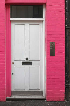 White Door at Pink Building in Londonの写真素材