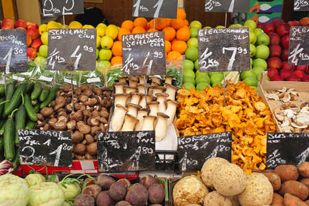Fungy Mushrooms and Produce in Crates at Farmers Marketの写真素材