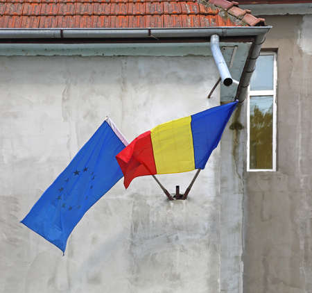 Romanian and European Flags at Buildingの写真素材