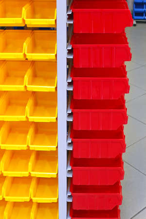 Red and Yellow Plastic Racks for Parts Storageの写真素材