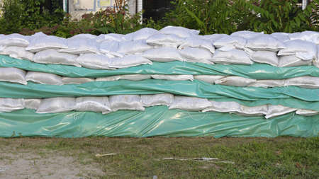 Wall of Sandbags and Tarp for Flood Protectionの写真素材