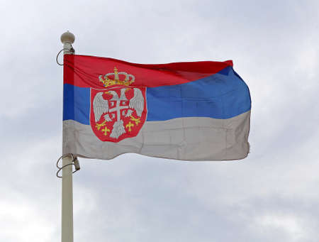 Serbian Flag Flying at Windの写真素材