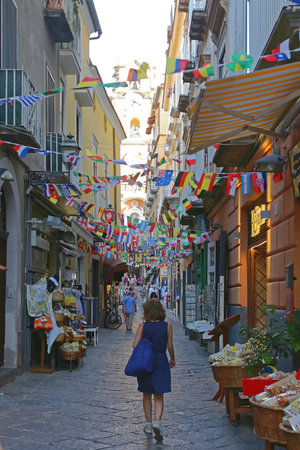 SORRENTO, ITALY - JUNE 26, 2014: Narrow Street With Flags Decoration in Sorrento, Italy.のeditorial素材