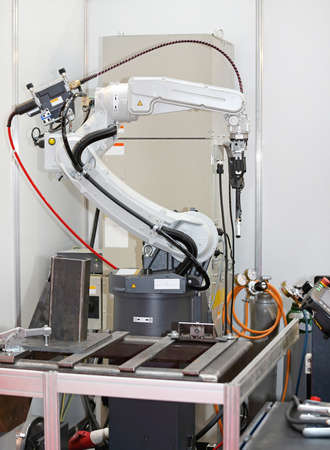 Robotic Arm Welding Parts in Factory