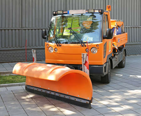 Snow Plow at Orange Truck For Road Maintenanceの写真素材