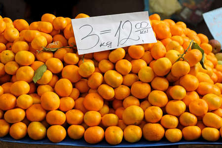 Big Pile of Mandarin Oranges at Marketの写真素材