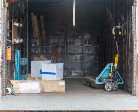 Boxes and Pallet Jack in Delivery Truck