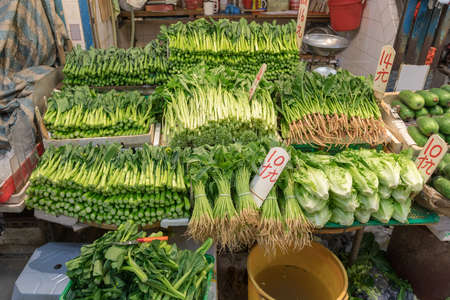 Fresh Leafy Greens at Farmers Market Stallの写真素材