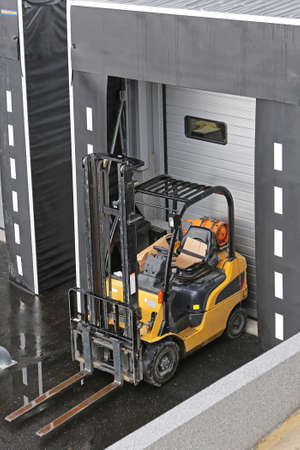 Forklift at Loading Dock Door Distribution Warehouse