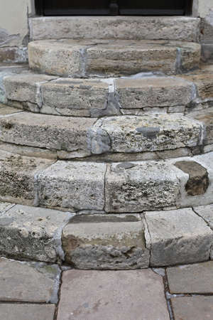 Round Stone Stairs at Building Exterior
