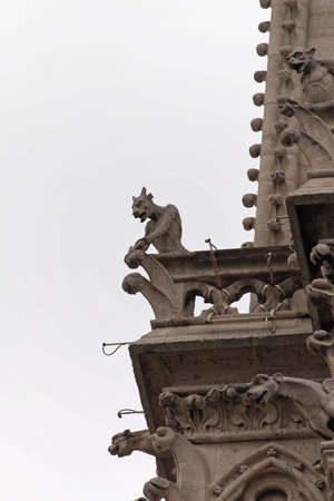Gargoyles Chimera Statues at Notre Dame Cathedral in Paris Franceの写真素材