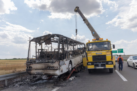 Belgrade, Serbia - June 03, 2018: Burned Coach Bus at Highway Recovery Assistance Near Belgrade, Serbia.のeditorial素材