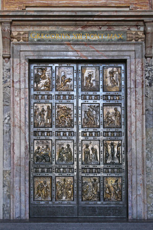 Vatican - October 26, 2009: The Holy Door at Saint Peter Cathedral in Vatican City.のeditorial素材