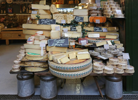 LONDON, UNITED KINGDOM - NOVEMBER 20, 2013: A Variety of Cheeses for Sale in Cheese Shop at Borough Market in London, United Kingdom.のeditorial素材