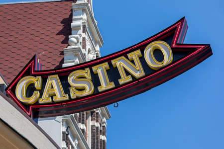 Big Casino Sign Arrow at Top of Buildingの写真素材