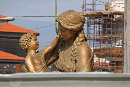 Skopje, Macedonia - September 17, 2012: Bronze Statue of Mother and Child Fountain During Construction in Skopje, Macedonia.のeditorial素材
