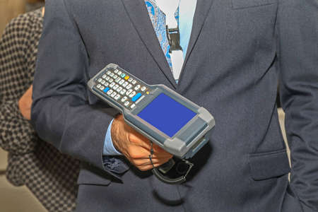 Man Holding Handheld Barcode Scanner Reader Portable Computer