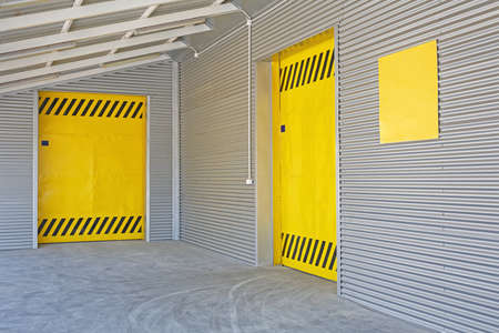 Two Yellow Loading Doors at Distribution Warehouseの写真素材