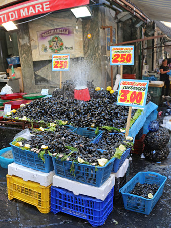 NAPLES, ITALY - JUNE 22, 2014: Crates With Mussels in Front of Seafood Shop at Porta Nolana Market in Napoli, Italy.のeditorial素材