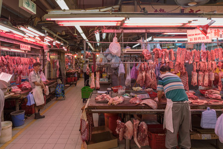 KOWLOON, HONG KONG - APRIL 21, 2017: Butcher Stall at Fa Yuen Street Market in Kowloon, Hong Kong.のeditorial素材