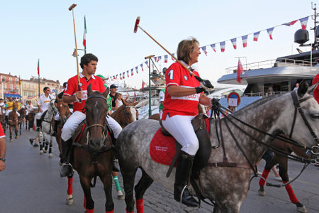 SAINT TROPEZ, FRANCE - JULY 12, 2013: Saint Tropez Polo Team Parade at Horses During International Polo Cup in Saint Tropez, France.のeditorial素材