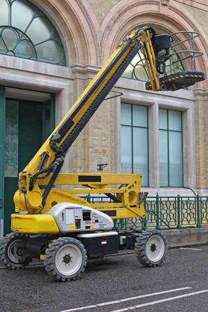Yellow Articulated Boom Lift Platform for Construction Work