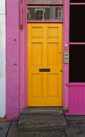 Yellow Door With Pink Doorway in Portobello Londonの写真素材