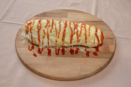 Folded Calzone Italian Cuisine at Wooden Tray