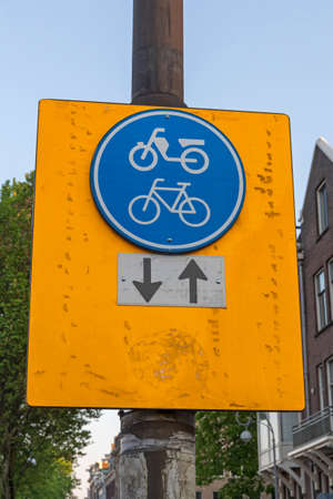 Dual Bike and Scooter Lane Sign in Amsterdamの写真素材