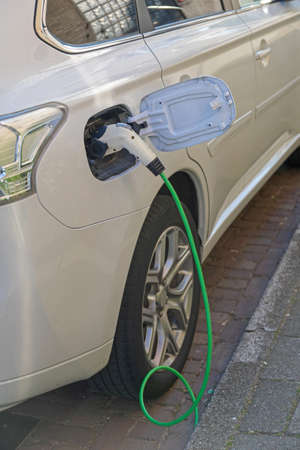 Charging Cable Electric Car Plug in at Street