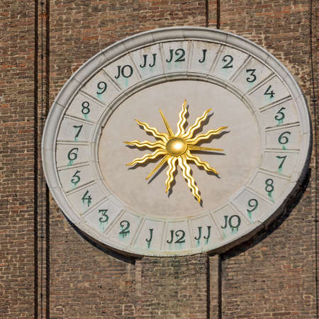 Clock Dial With Golden Sun at Tower in Venice