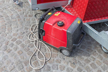 Portable Red Electric Power Generator at Streetの写真素材