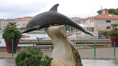 Rovinj, Croatia - October 15, 2014: Bronze Sculpture of Dolphin Monument in Rovinj, Croatia.のeditorial素材