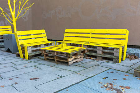 Recycled Cargo Pallets to Yellow Outdoor Furnitureの写真素材