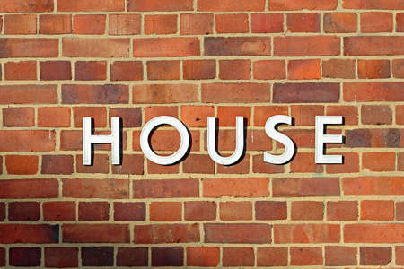 House Letters at Red Brick Wall Sunの写真素材