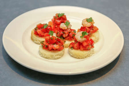 Small Shrimp and Tomato Sandwiches at Plateの写真素材