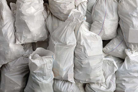 Bunch of White Sacks With Trash at Street
