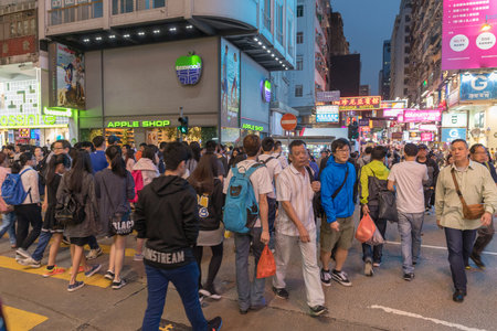 Kowloon, Hong Kong - April 22, 2017: Pedestrians Crossing Over Argyle Street in Mong Kok, Kowloon, Hong Kong.のeditorial素材