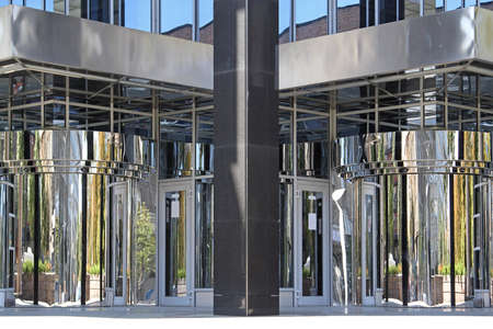 Revolving Silver Doors Entrance to Modern Office Buildingの写真素材