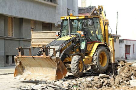 Backhoe Loader Digger at Road Works Construction