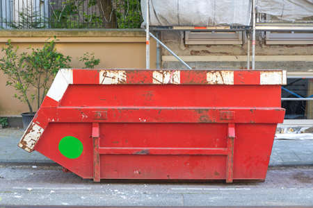 Big Red Skip Container at Construction Site in Cityの写真素材