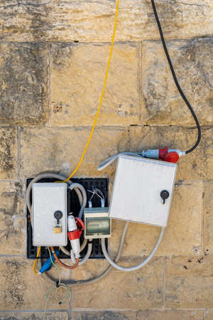 Electric Power Box With Cables and Wires at Exterior Wallの写真素材