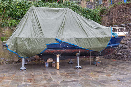 Boat Covered With Tarp Packed For Winter Outsideの写真素材